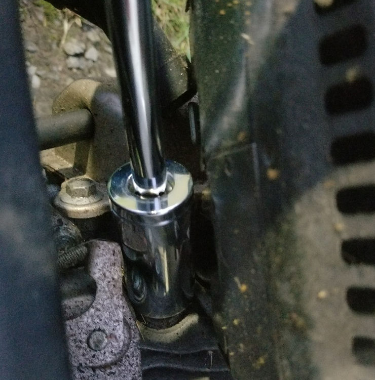 Deep well socket on generator spark plug removal, image Spark plug removal on Honda Generator